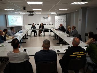 Los asistentes al acto, durante la ponencia